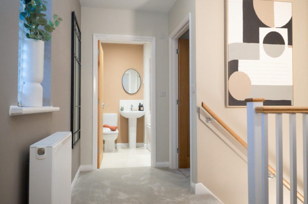Hallway, looking through to the home main bathroom.
